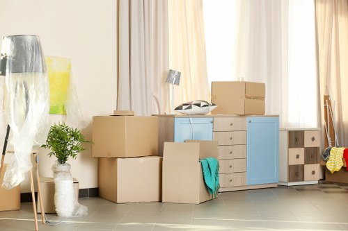Man with van removal loading furniture for a local move in Removals