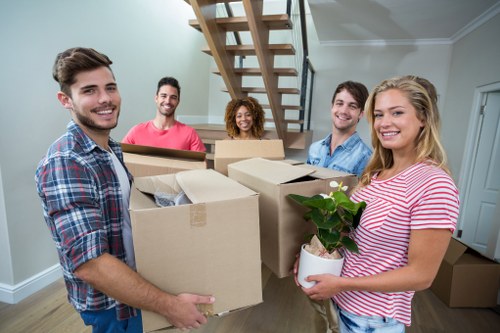 Office relocation team preparing desks and boxes for a local business move
