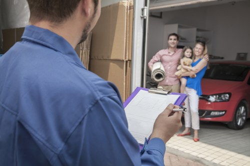 Workers and a removal van representing ethical transport operations
