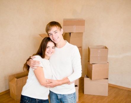 Removal team supporting a local house move with furniture and boxes