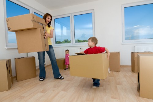 Furniture and boxes being moved by a local removals team