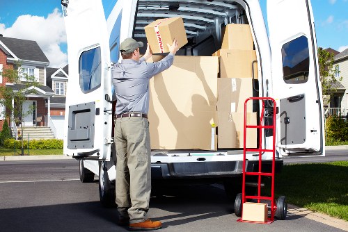Careful loading of household furniture during a local collection
