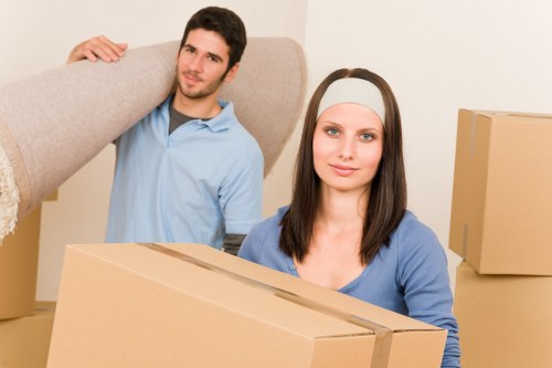 Business relocation equipment and furniture being loaded for transport