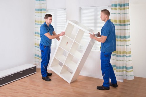 A moving team handling furniture in a residential property