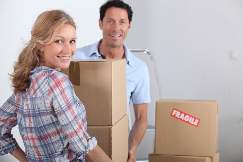 Professional removals team handling bulky furniture pick-up