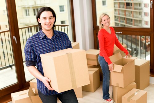 Removals team organising boxes for unpacking in a new home