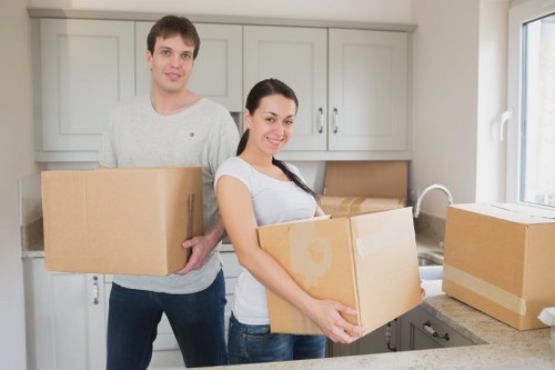 Movers loading household furniture into a van